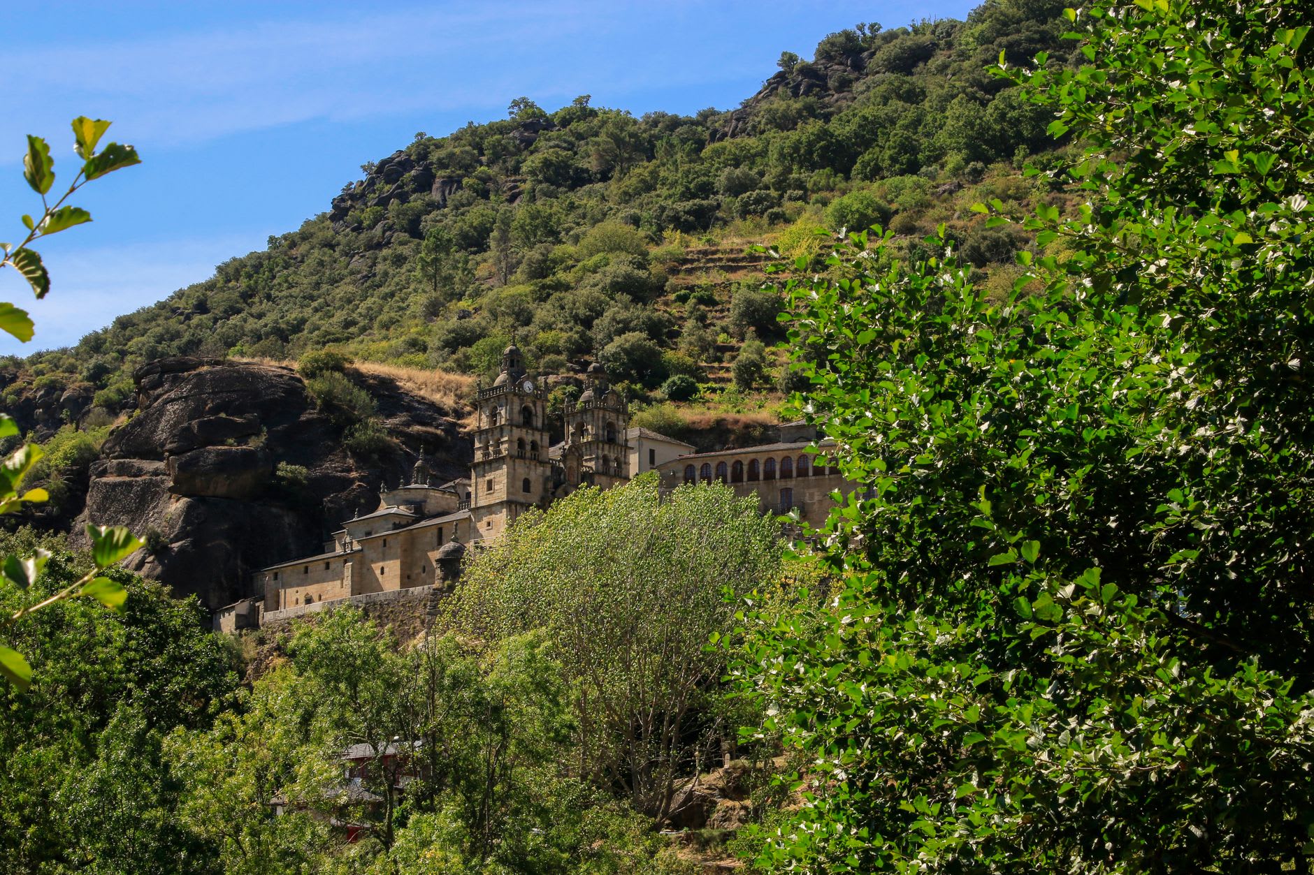 The triple cloisters of Santo Estevo monastery in the Ribeira Sacra, afternoon light on Romanesque carved columns