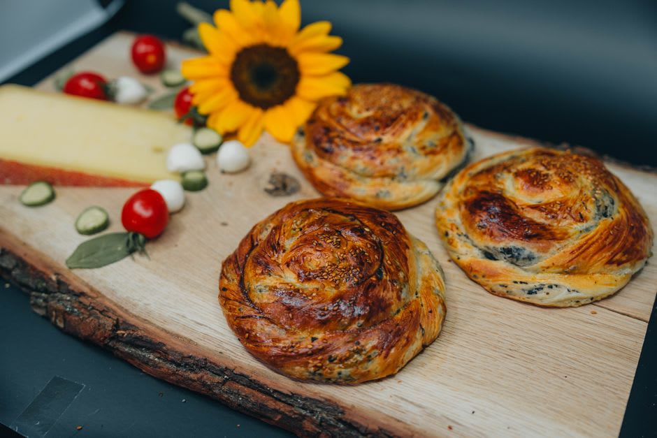 A freshly made Circassian cheese pastry served with garlic butter sauce at a Kfar Kama restaurant