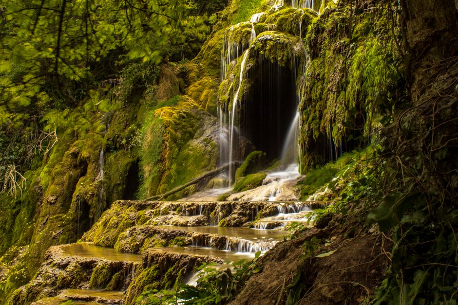 The Tanur waterfall dropping through a narrow basalt gorge in the Iyon Nature Reserve near Metula