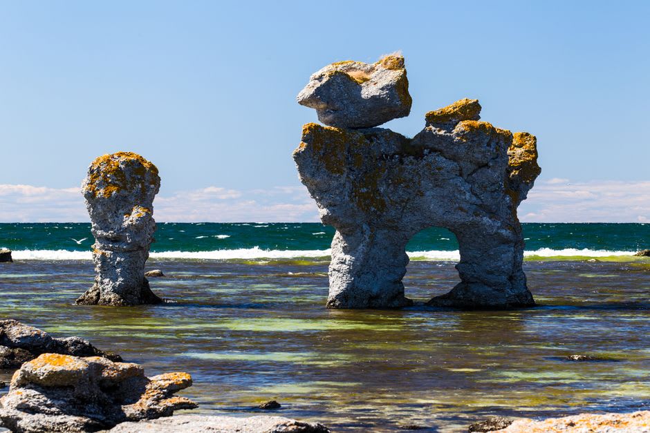 The rocky western shoreline of Stora Karlsö with Baltic Sea waves below the cliffs