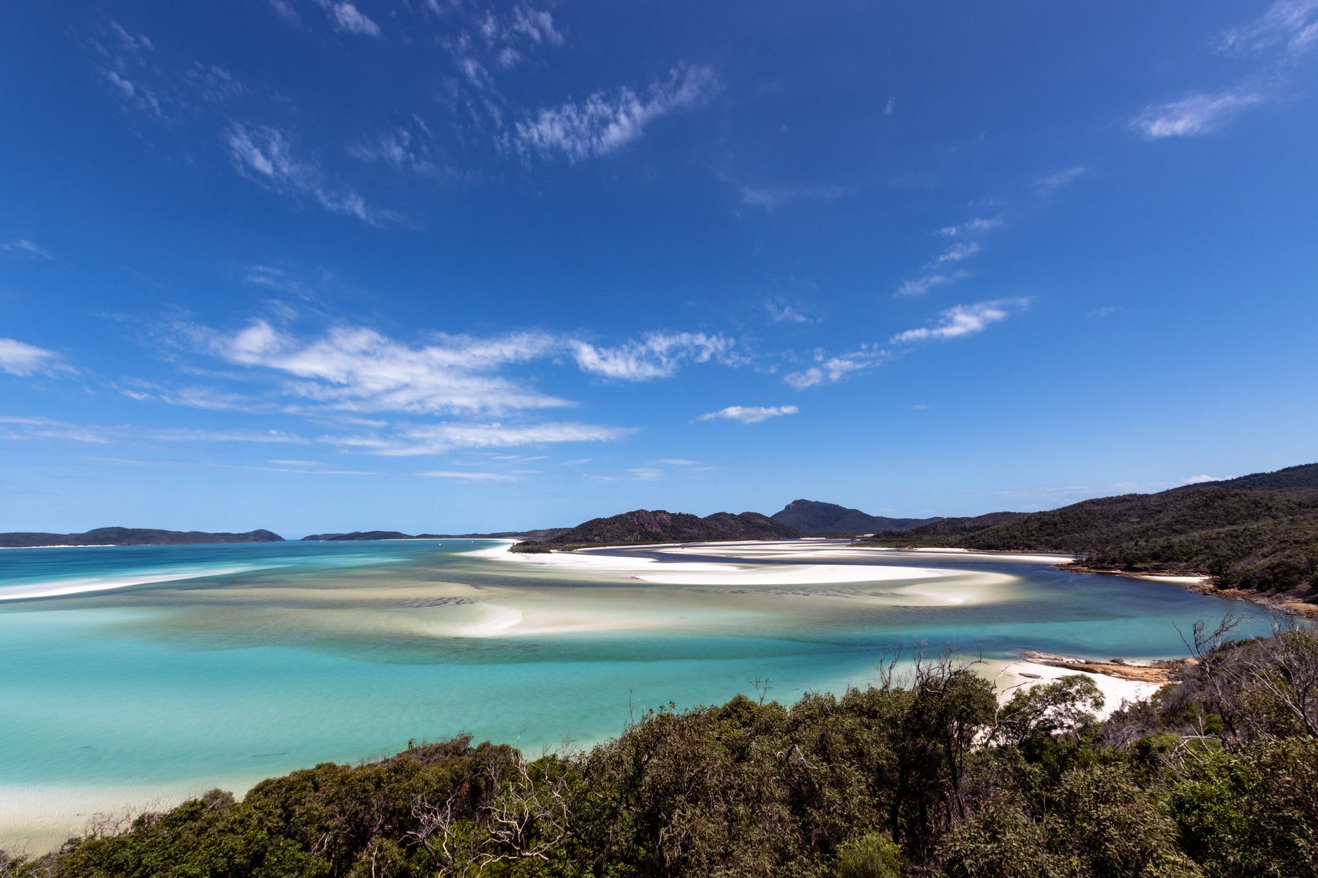 The Hill Inlet lookout view at Whitsunday Island — swirling white sand and turquoise water tidal channels from above