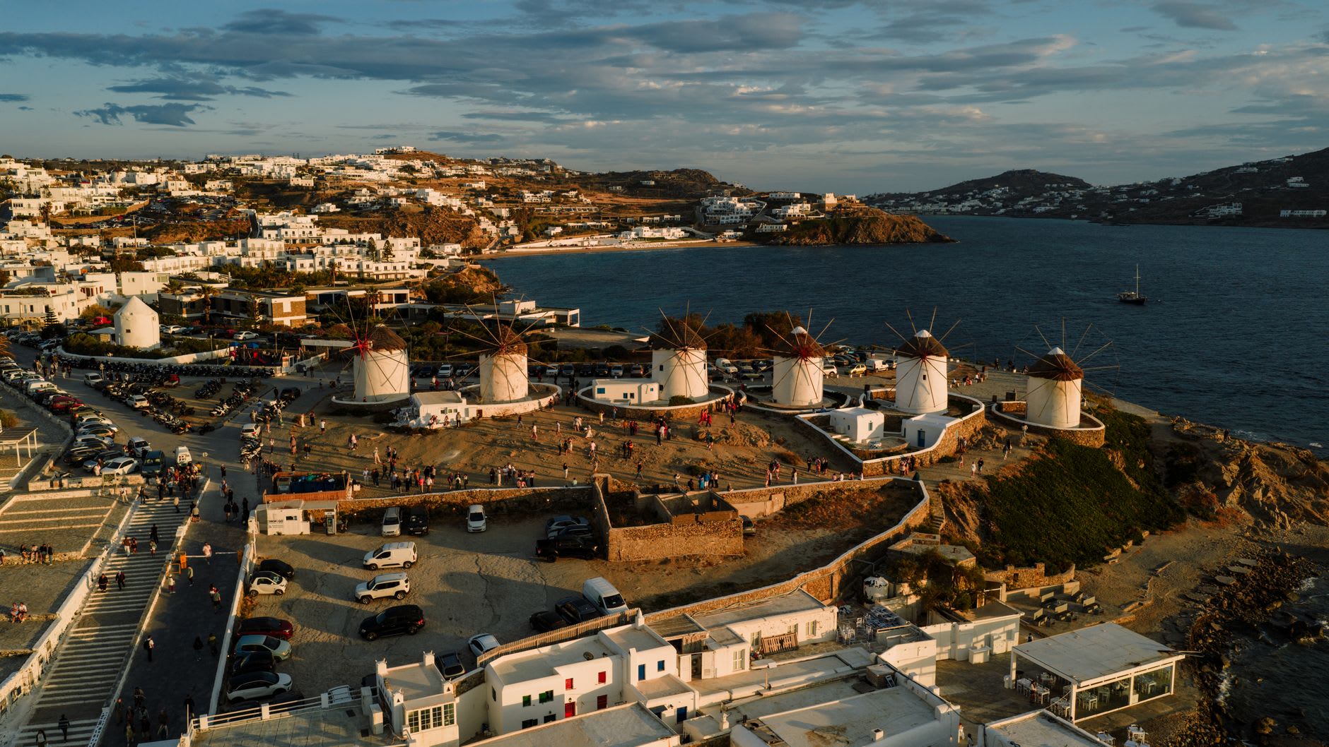 Kato Mili windmills of Mykonos Town standing against a vivid blue sky above the sea
