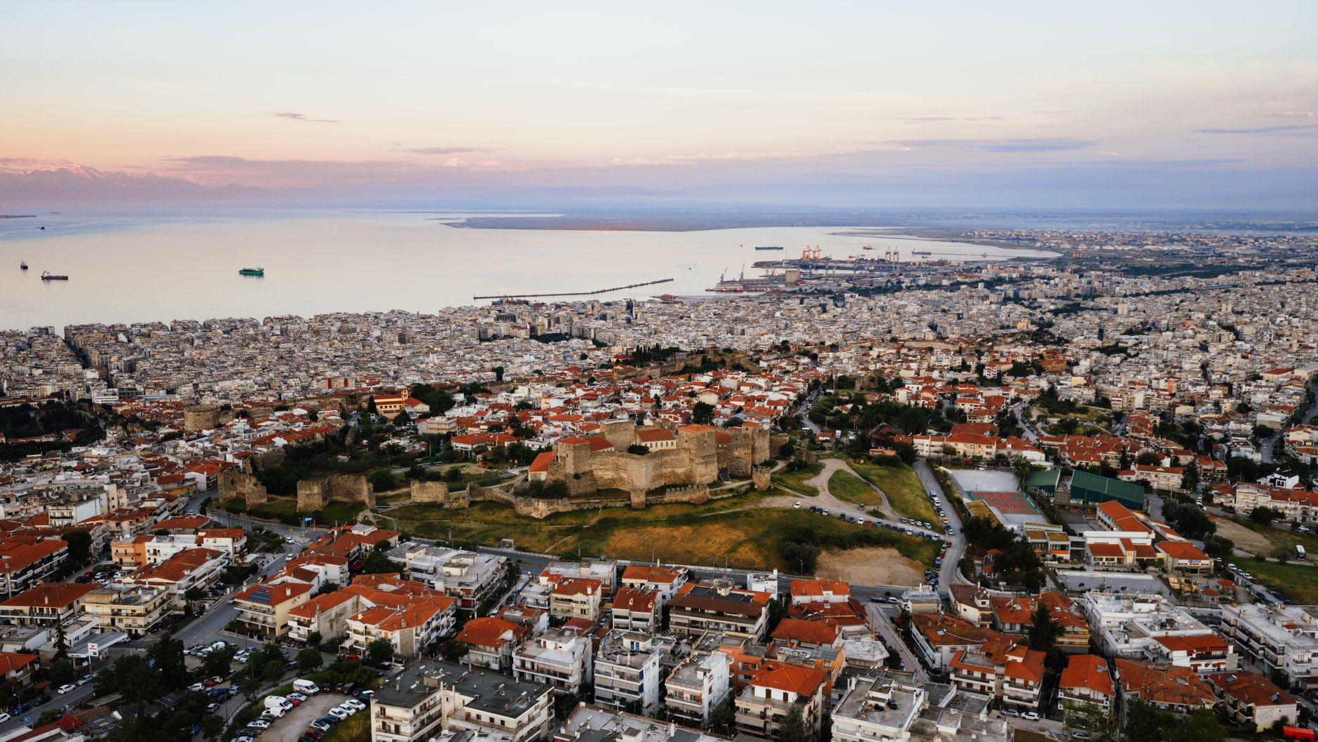 Byzantine ramparts and Ottoman towers of Ano Poli rising above Thessaloniki in the morning light