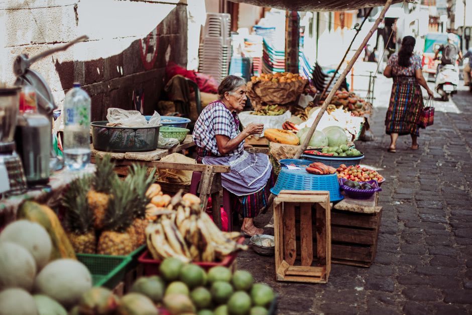 A local market stall selling fruit and vegetables on the modest plaza of Ciudad Vieja, Guatemala