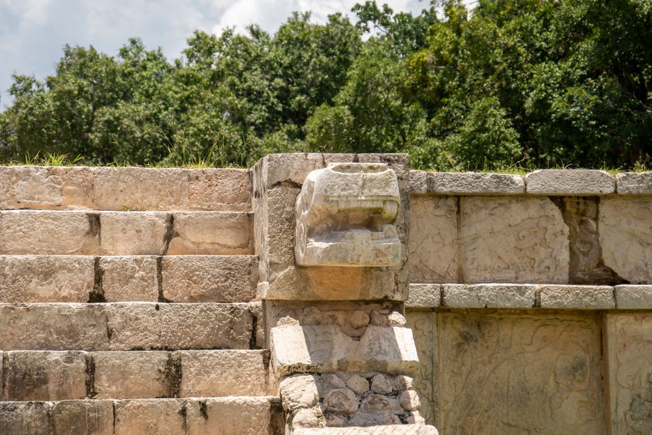 A carved zoomorphic boulder monument depicting a mythological creature at Quiriguá archaeological park