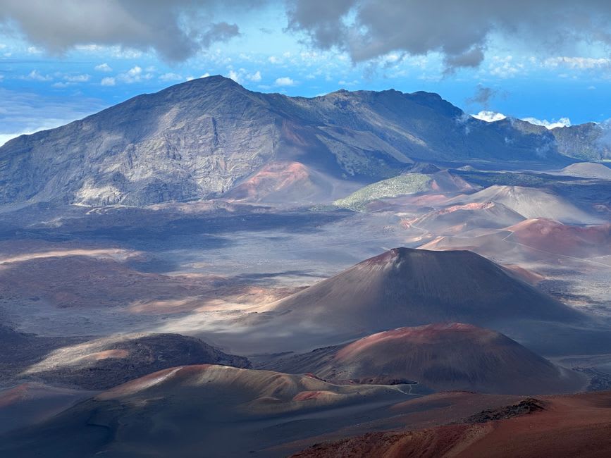 The vast volcanic crater floor of Haleakala with multiple cinder cones visible in morning light