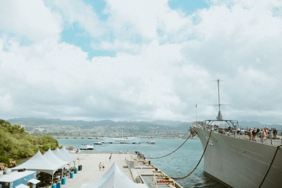 USS Bowfin submarine docked at Pearl Harbor with visitors on deck
