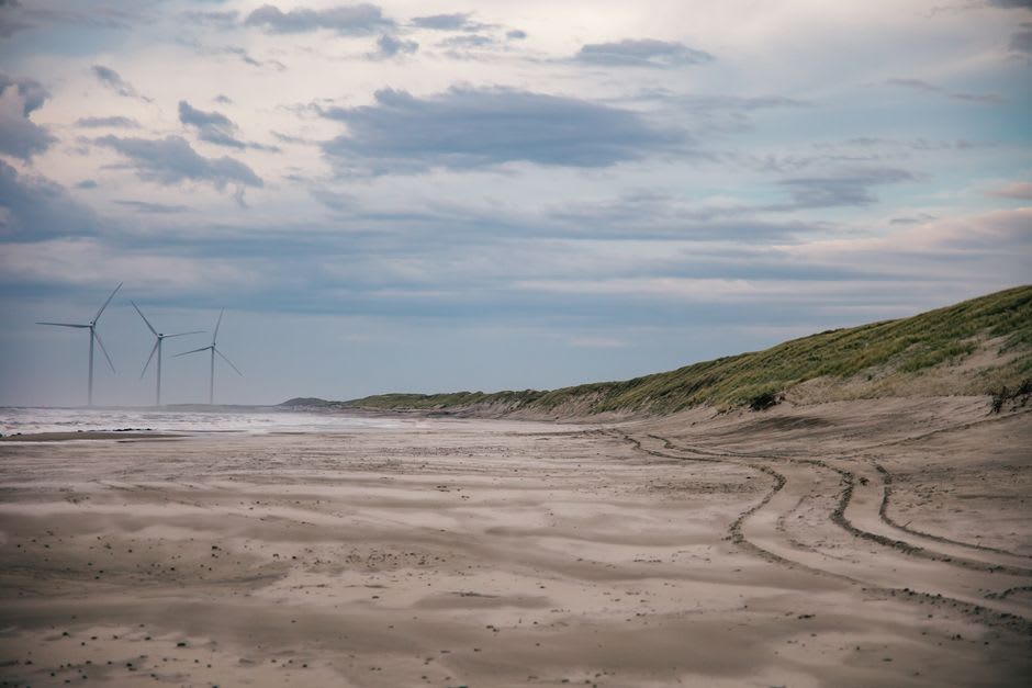Wind turbines lining the hills above Wakkanai with the strait toward Sakhalin Island visible in the distance