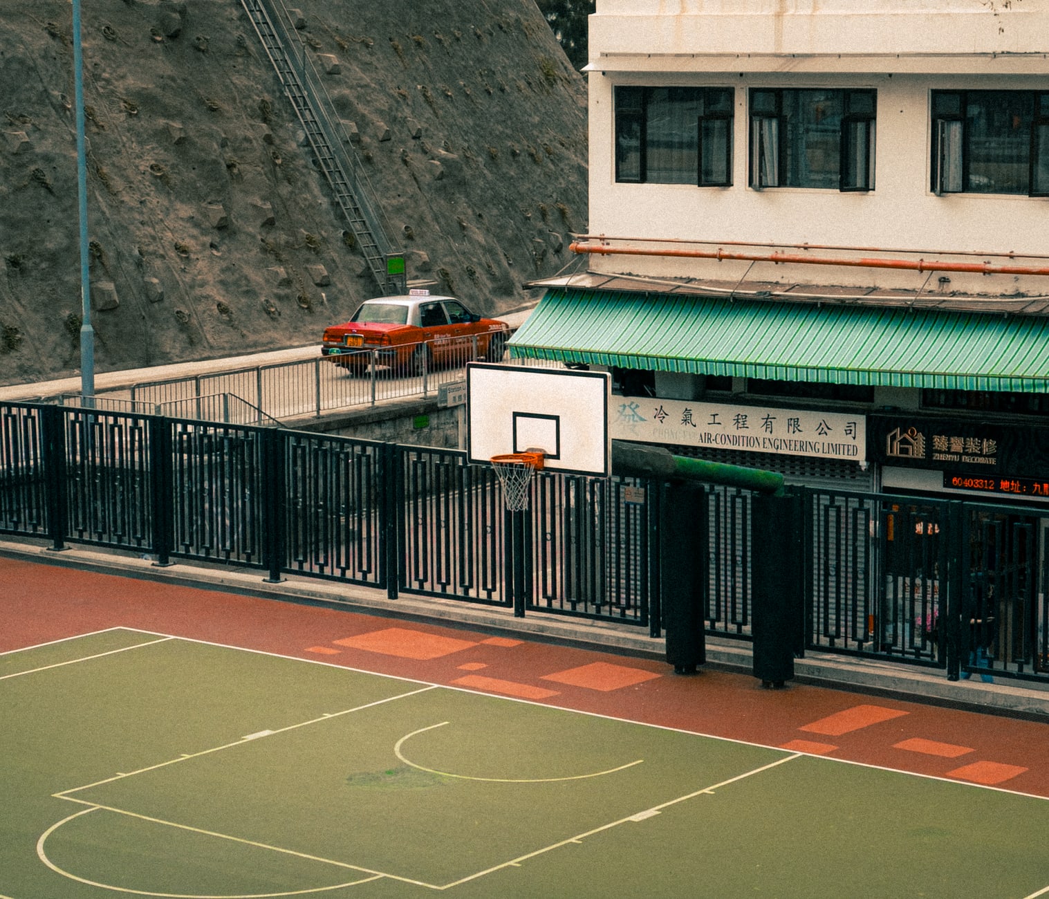 A scale model of the former Kowloon Walled City displayed near the park entrance, showing its extraordinary vertical density
