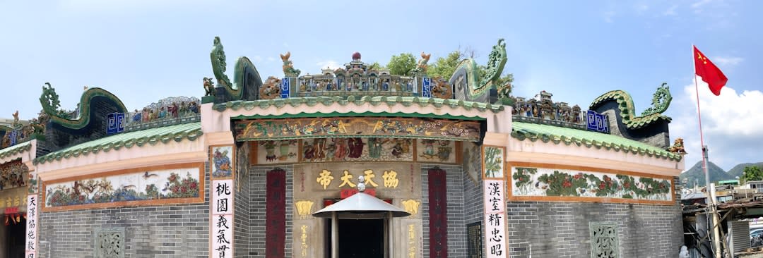 Rows of grey-brick Hakka houses inside the walled village, arranged symmetrically along a narrow central lane