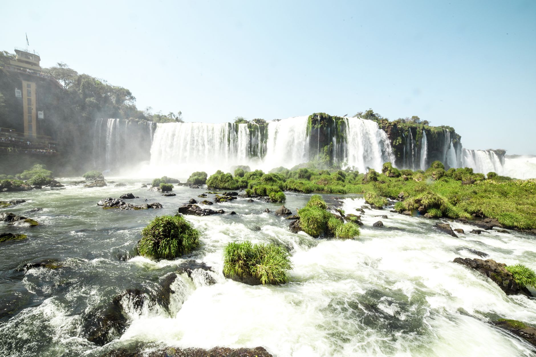 The Salto Bossetti waterfall seen from close range on the Lower Circuit walkway, spray creating a constant fine mist