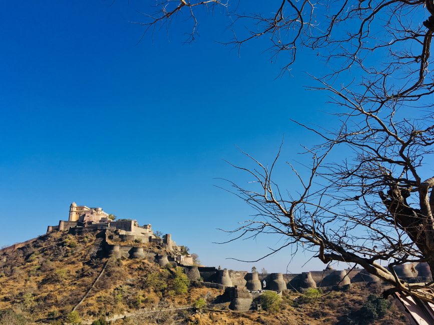The weathered stone ramparts of Bala Qila fort overlooking the Alwar valley