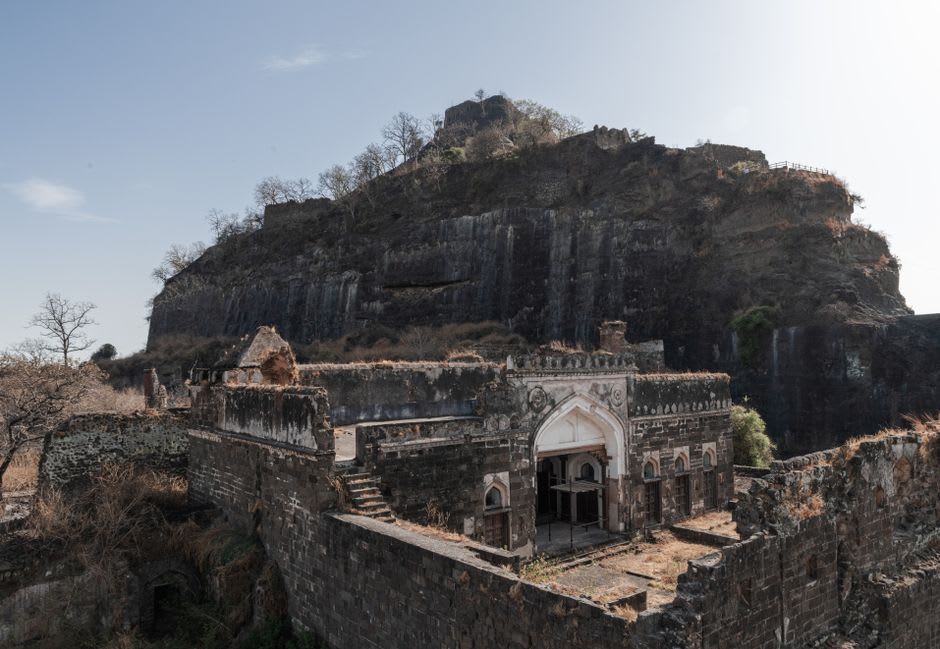 The dark spiral tunnel cut through rock inside Daulatabad Fort