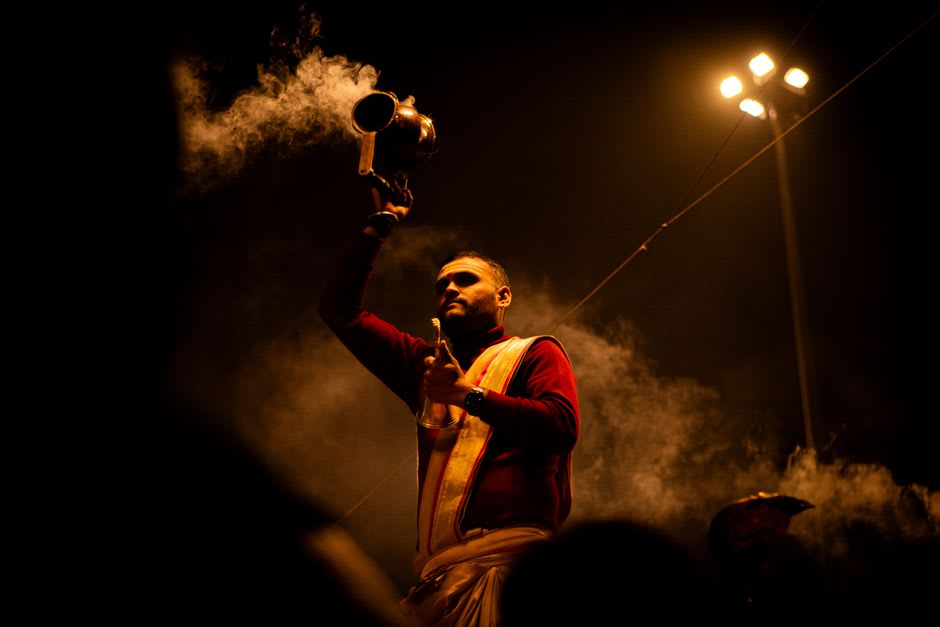 Diyas and pilgrims gathered on the Sarayu river ghats during evening aarti