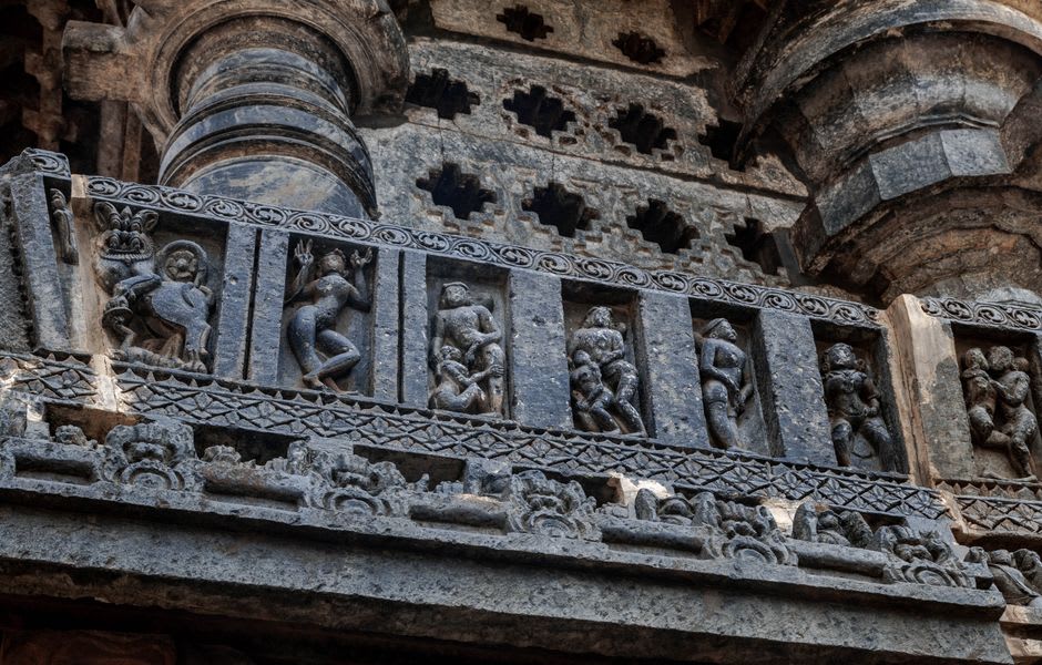 Rows of carved elephant and mythological friezes along the plinth of Hoysaleswara Temple at Halebidu