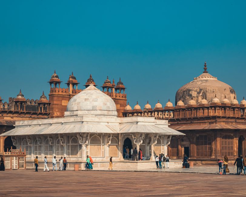 The delicately latticed white marble tomb of Salim Chishti inside the mosque courtyard
