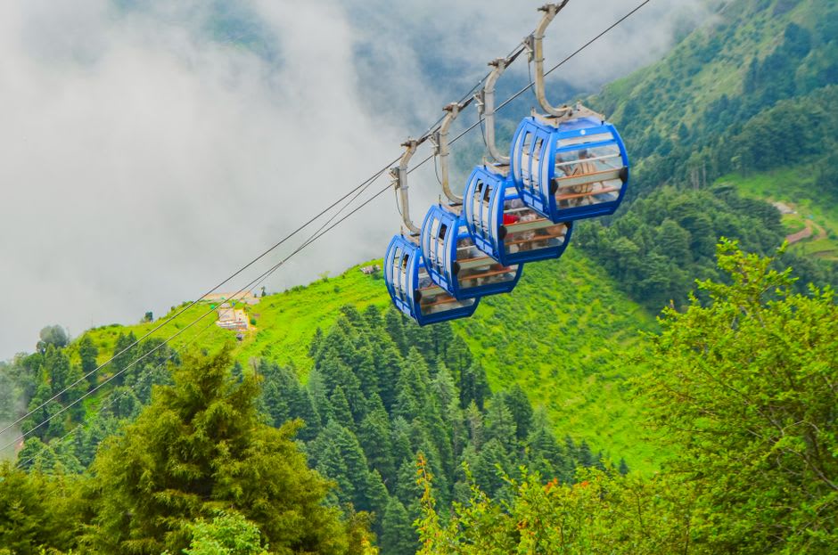 Gangtok's ropeway cable car crossing the valley with terraced hillside houses below