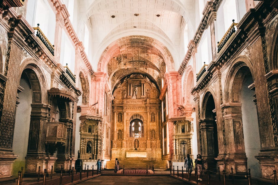 A baroque Portuguese church facade surrounded by tropical vegetation