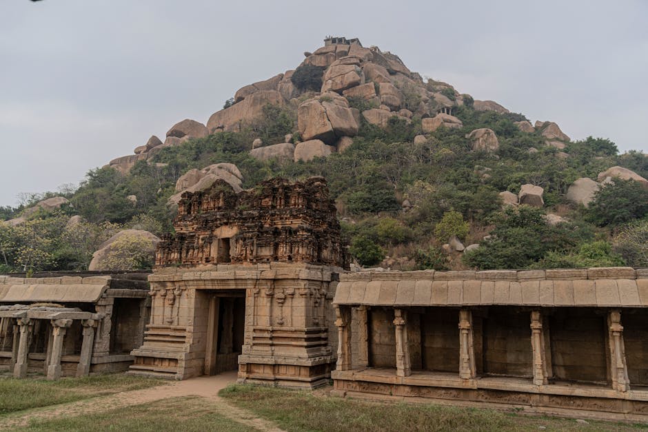 Ancient temple ruins scattered among massive granite boulders at Hampi