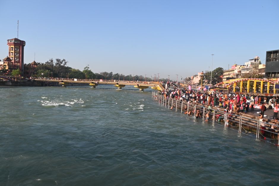 The Ganges flowing wide and calm through Haridwar as seen from the hillside above town