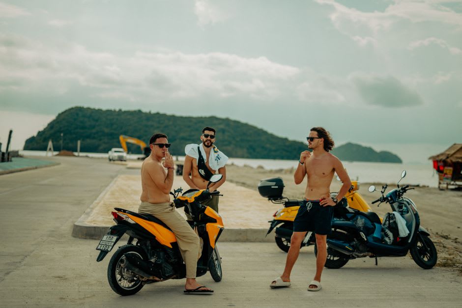 A scooter parked on the sandy road leading to Radhanagar Beach on Havelock Island