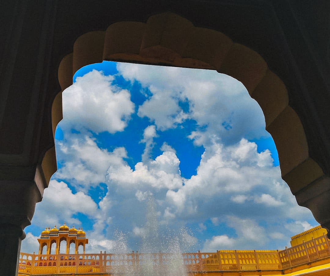 Hawa Mahal's honeycombed sandstone windows catching the first light of morning