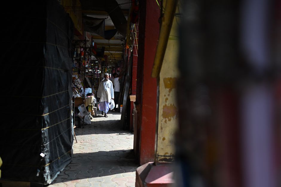 A quiet street in Kalimpong's old market area lined with small shops