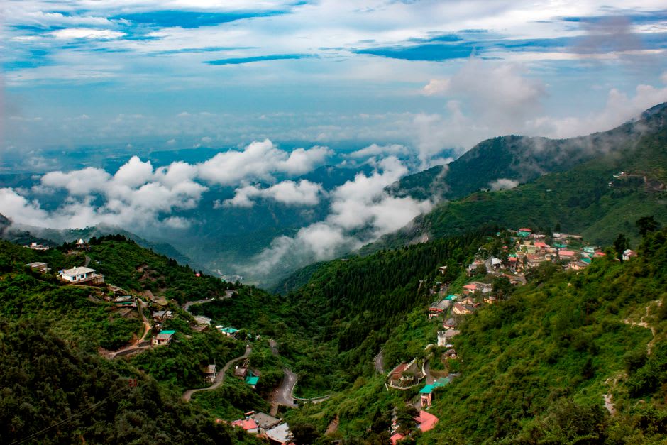The green sweep of the Doon Valley seen from Mussoorie's ridge at sunset