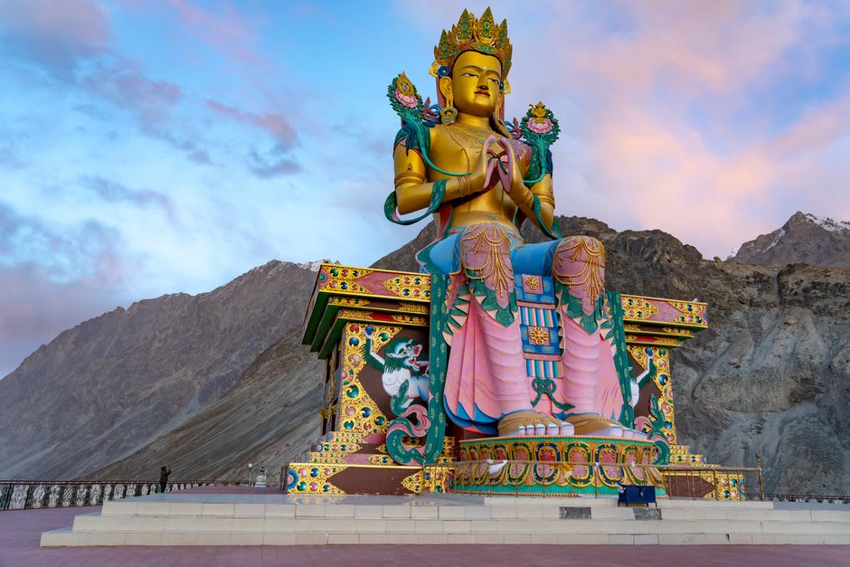 The giant golden Maitreya Buddha statue at Diskit Monastery overlooking Nubra Valley