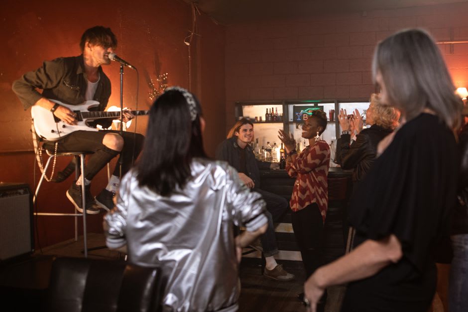 A local band performing live guitar music in a Shillong bar in the evening