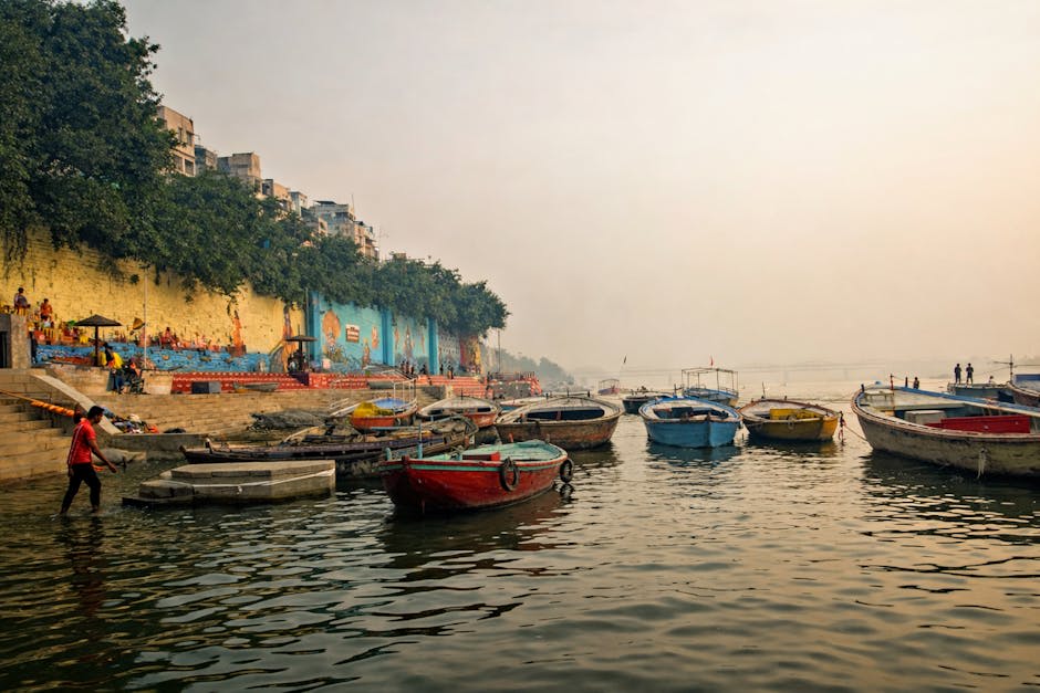 Boats on the Ganges at Varanasi with the city ghats rising behind