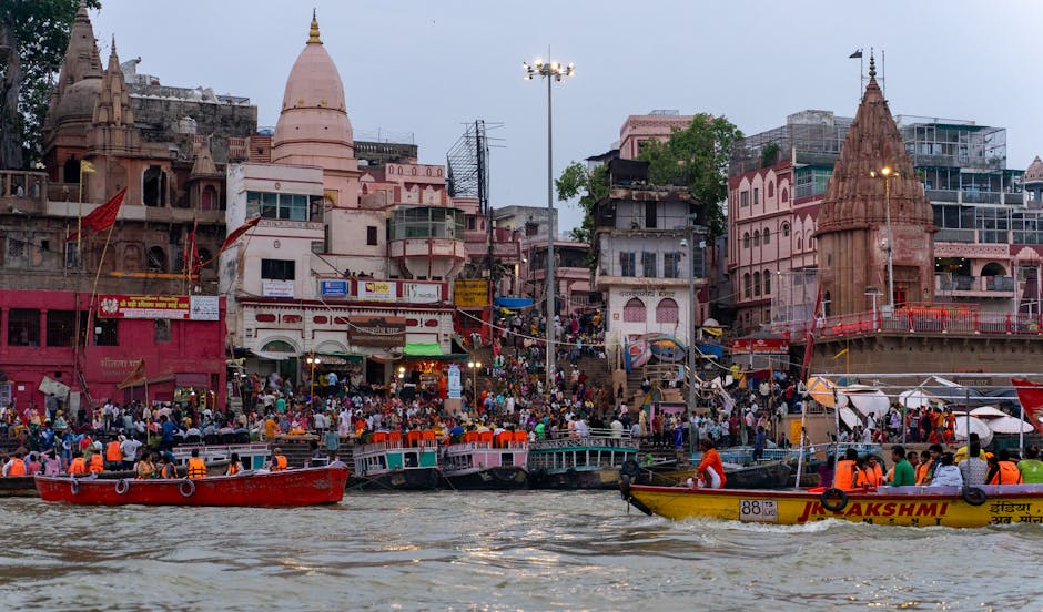 Evening aarti ceremony with priests holding flaming lamps on the ghats