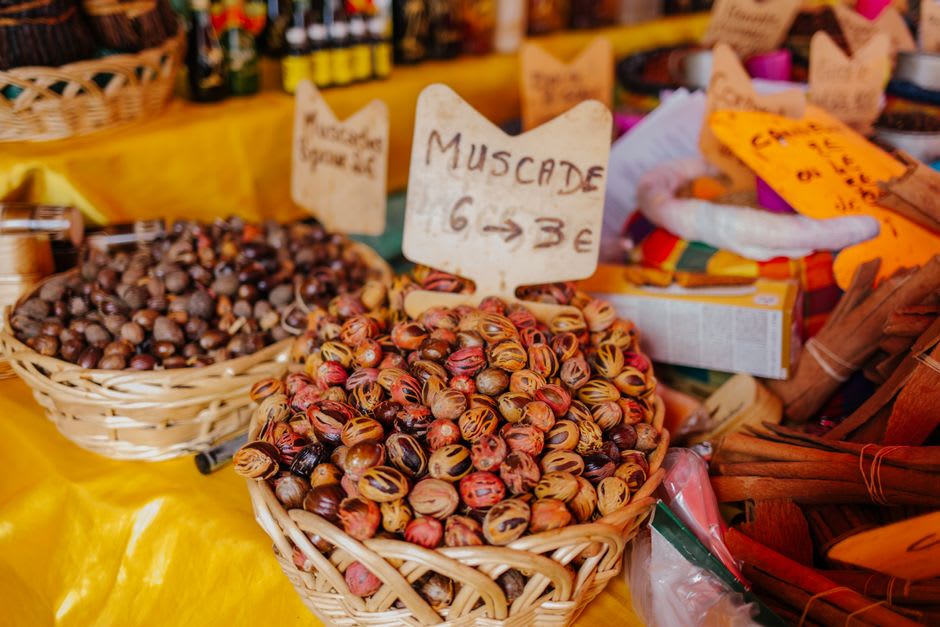 Traditional spice market stall in Ambon with dried cloves and nutmeg on display