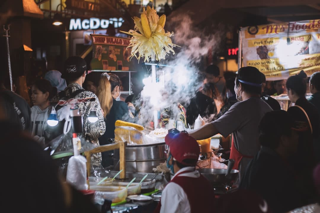 Steam rising from food stalls at Galabo night market in Solo after dark