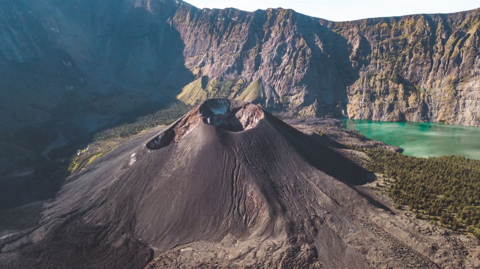 View from Puncak Lawang viewpoint looking down over the full crater rim of Lake Maninjau
