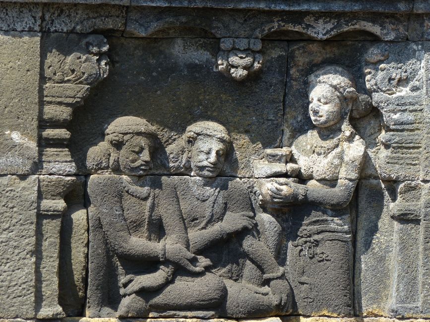 Detailed stone relief carvings on the base of the central Shiva temple at Prambanan