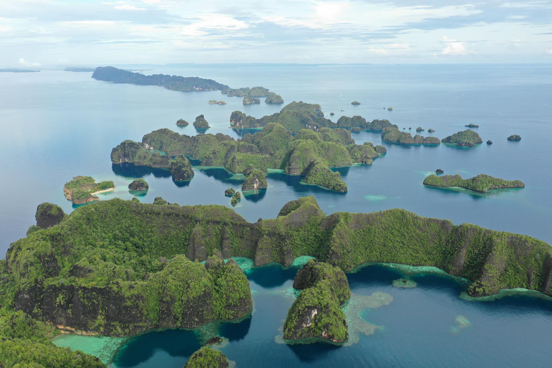 Pristine turquoise waters and limestone formations in Raja Ampat