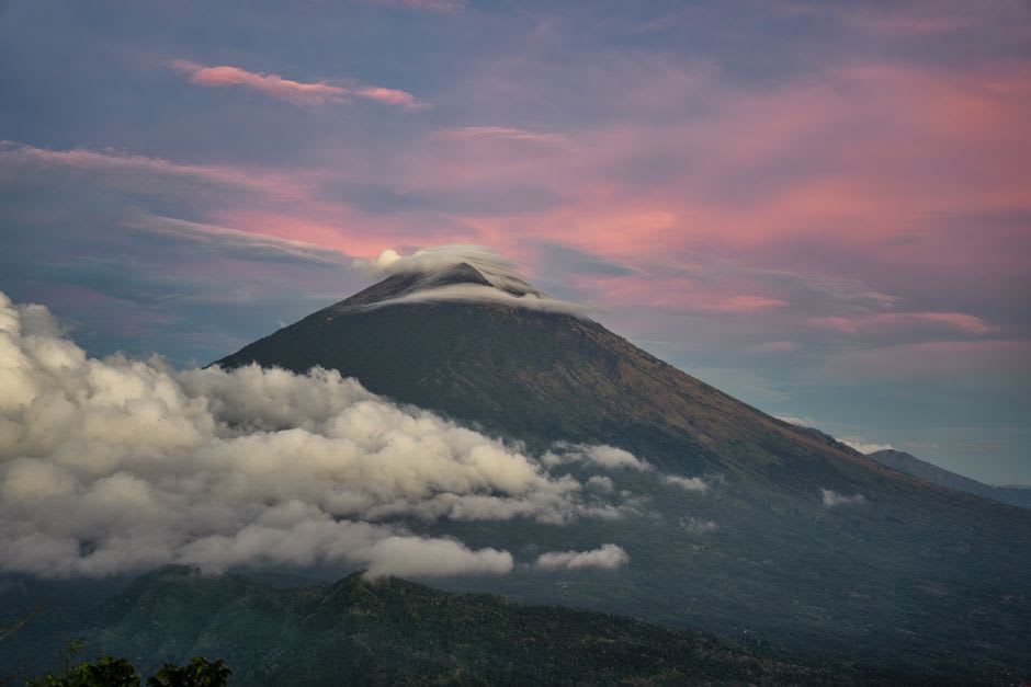 Sunrise over Gunung Agung volcano seen from a ridge trail above the Sidemen rice terraces