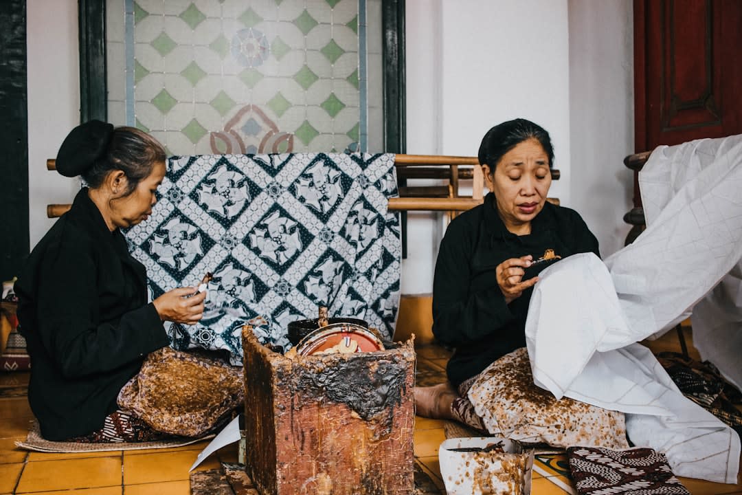 A Sumbanese woman weaving traditional ikat cloth on a backstrap loom