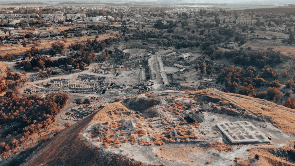 The 7,000-seat Roman theater at Beit She'an with the ancient tell mound visible behind it