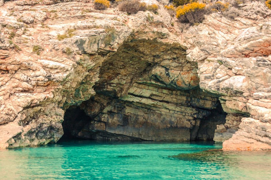 Sea cave interior at Rosh Hanikra with turquoise water and wooden walkway