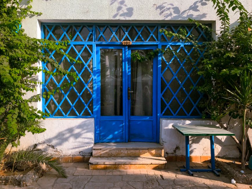 Blue-painted doorway in the artists' quarter of Tzfat, Galilee mountains visible in the background