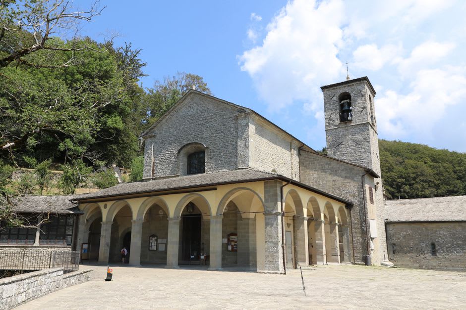 The wooded hillside and stone hermitage of the Eremo delle Carceri above Assisi