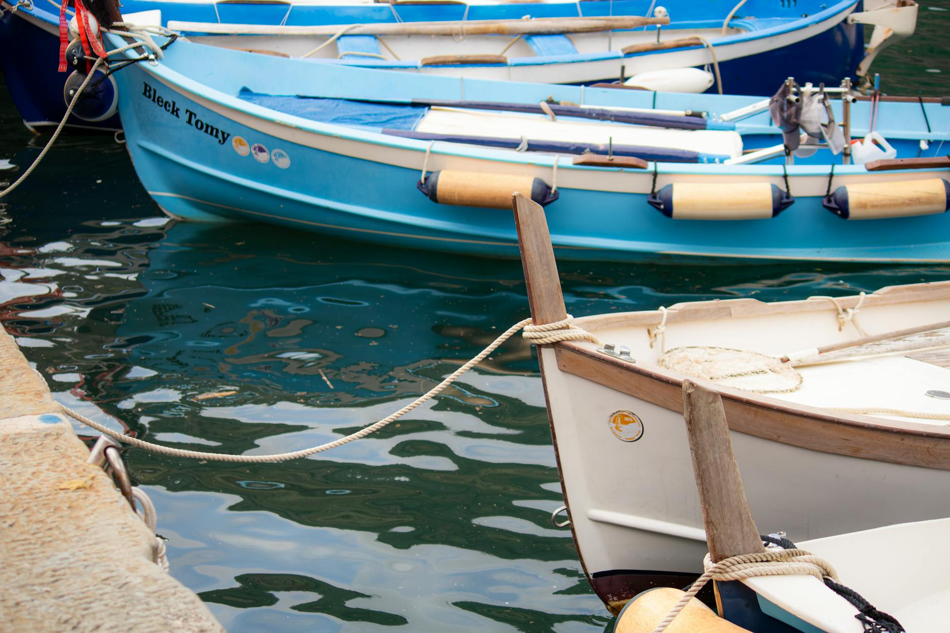 Vernazza's colorful harbor with boats and medieval tower