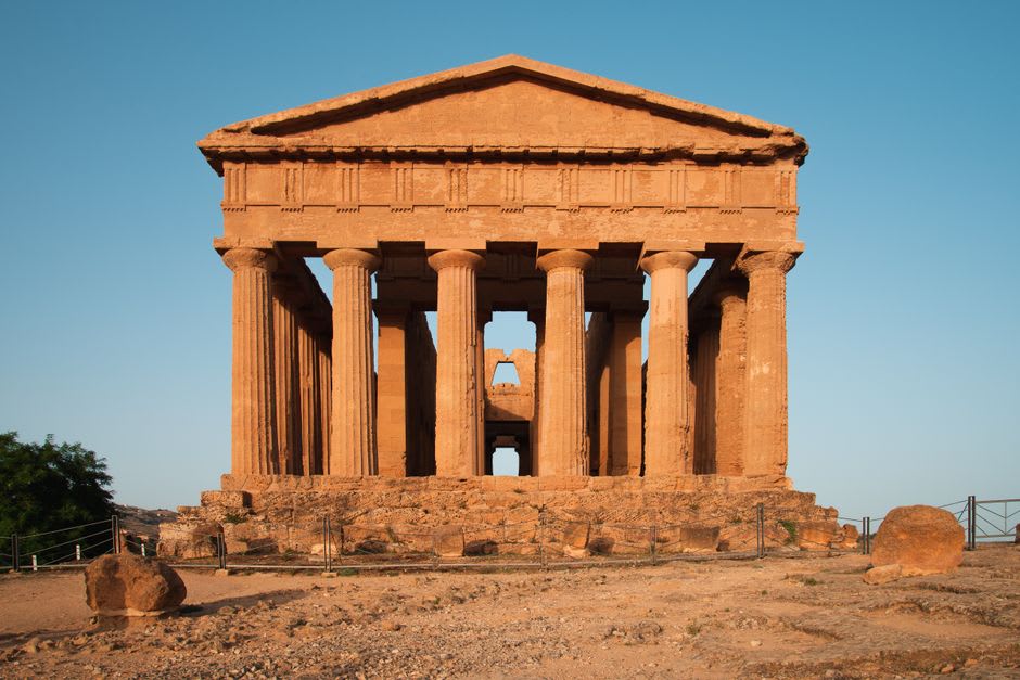 The thirty-four columns of the Temple of Concordia glowing gold at sunset