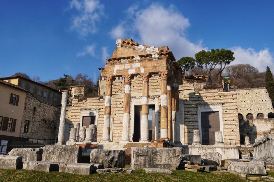 The Roman Capitolium temple ruins in Brescia's archaeological park