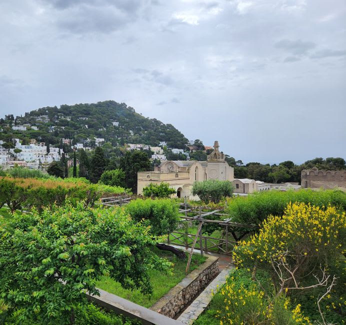 Ruins of Villa Jovis on Capri's eastern cliffs with a view down to the Bay of Naples