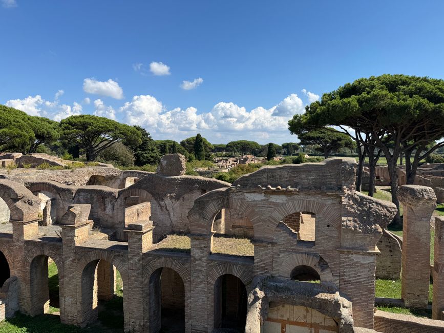 The ancient Roman theater of Ostia Antica, its stone seating tiers still intact after two thousand years