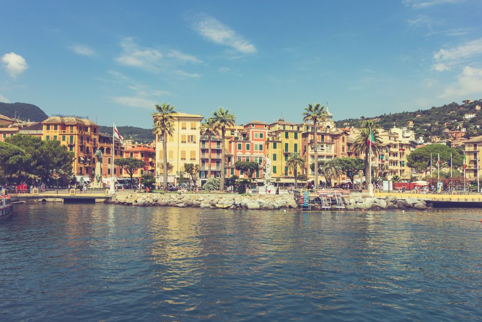 Sailboats moored in the harbor of Santa Margherita Ligure with the promenade behind