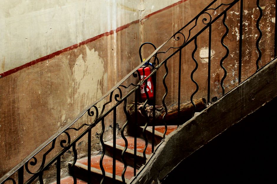 Wrought-iron balconies and narrow stone stairways in Ragusa Ibla's old town